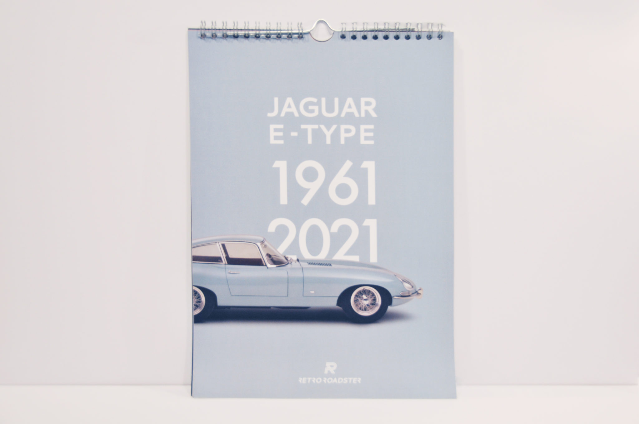 Jaguar E-Type calendar photographed open with historic car imagery