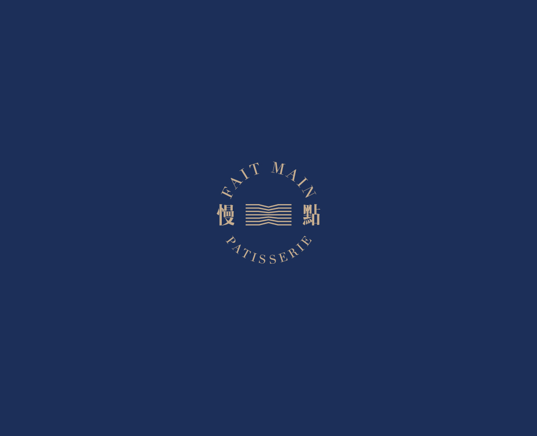 Fait Main Pâtisserie identity mark in gold on a deep blue menu cover